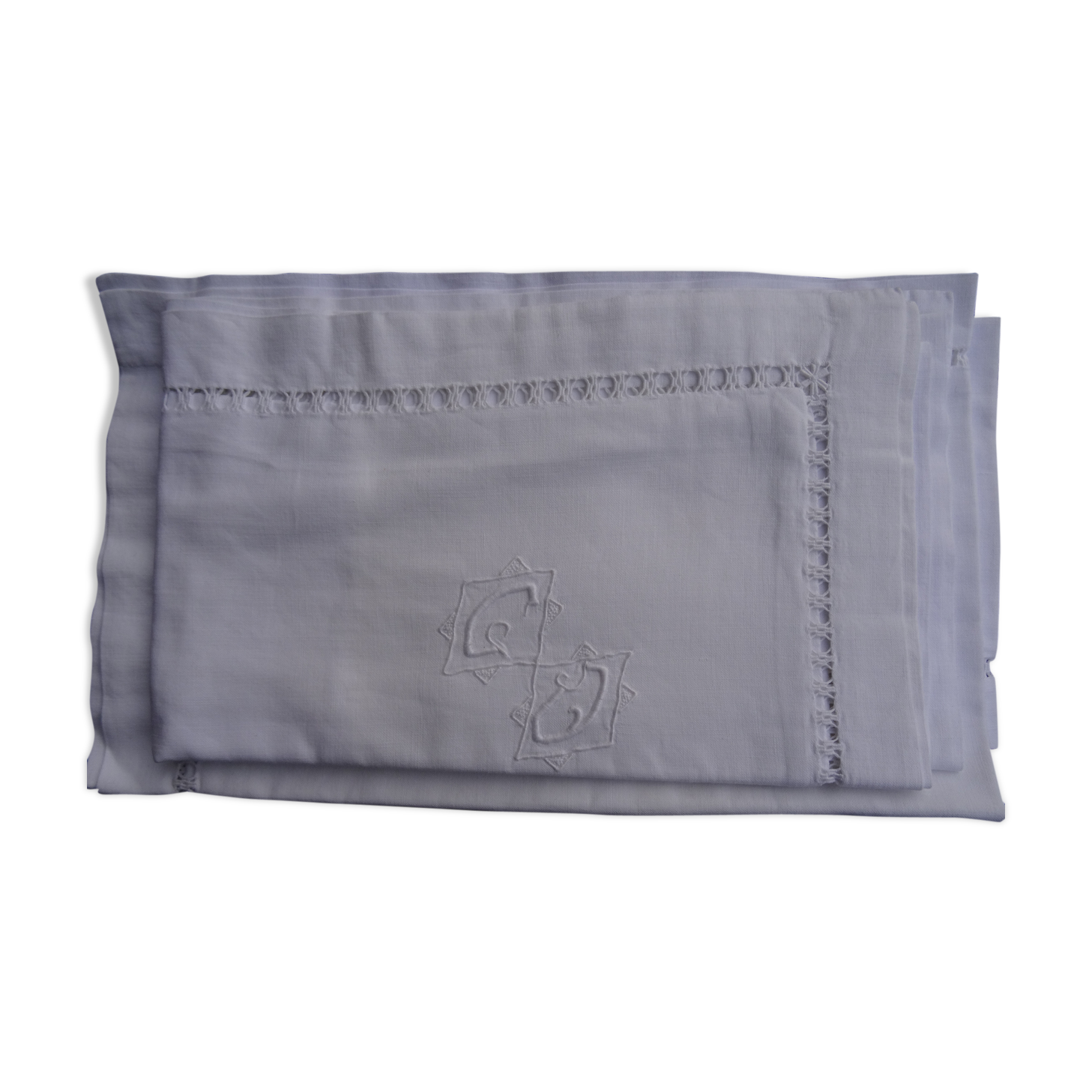 A pair of pillowcases monogrammed CD