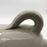 Old hot water bottle in glazed stoneware, gray color.