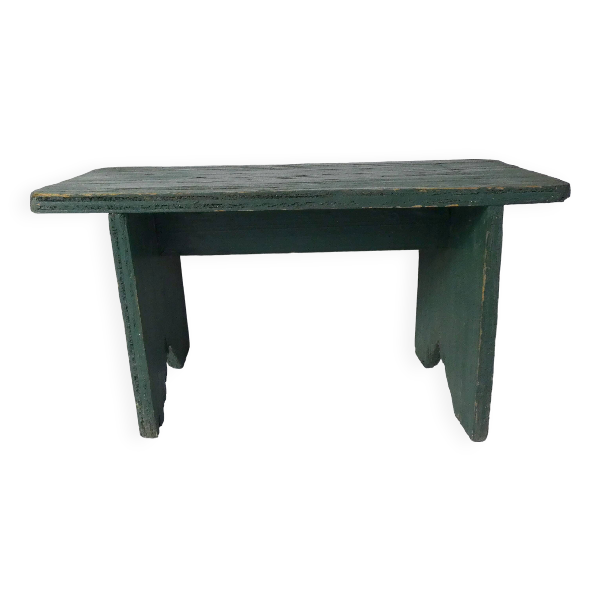 Old small wooden bench with green foot