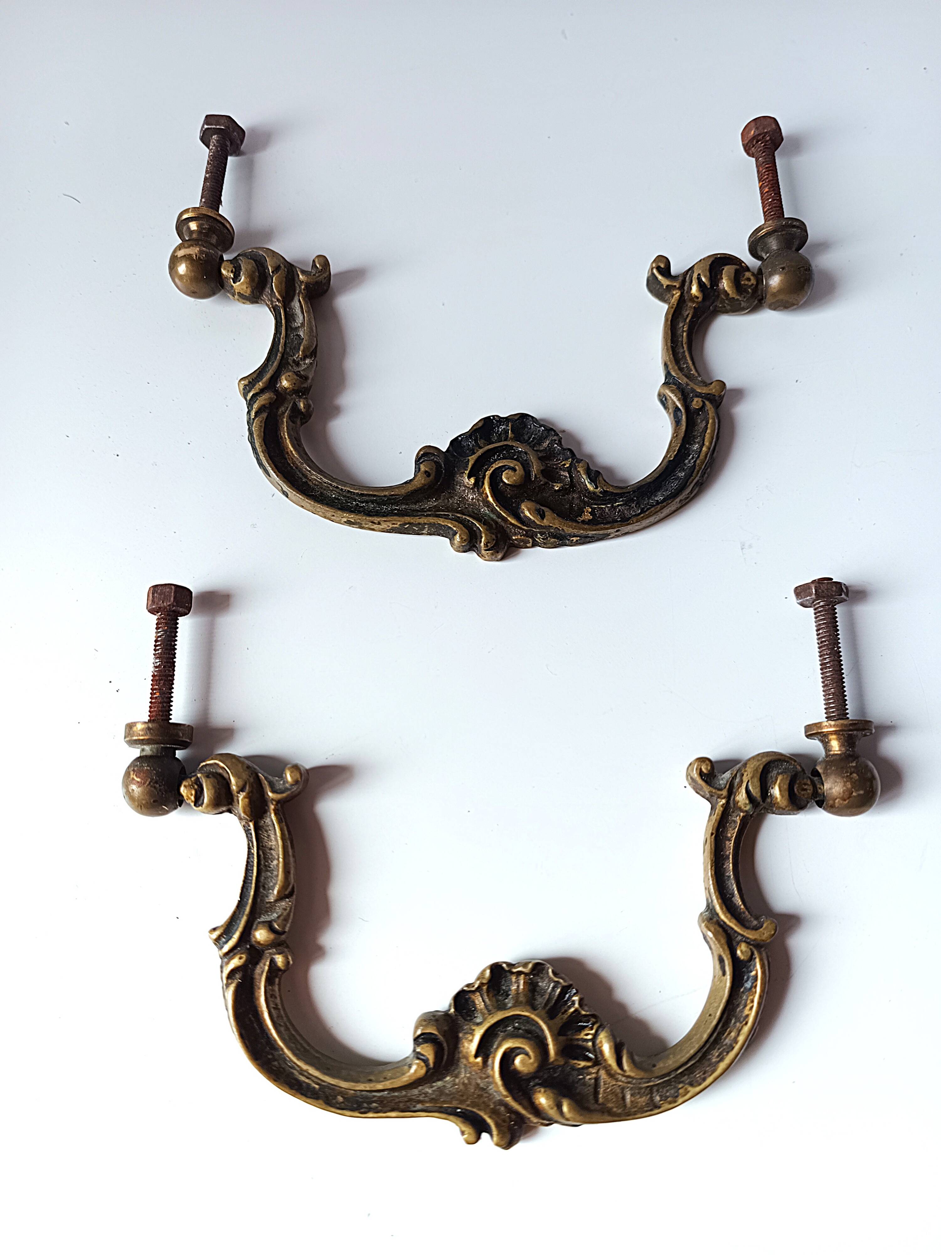 Antique pair of bronze drawer handles.