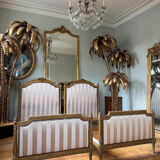 Pair of late 19th-century gilded wooden beds in Louis XVI style.