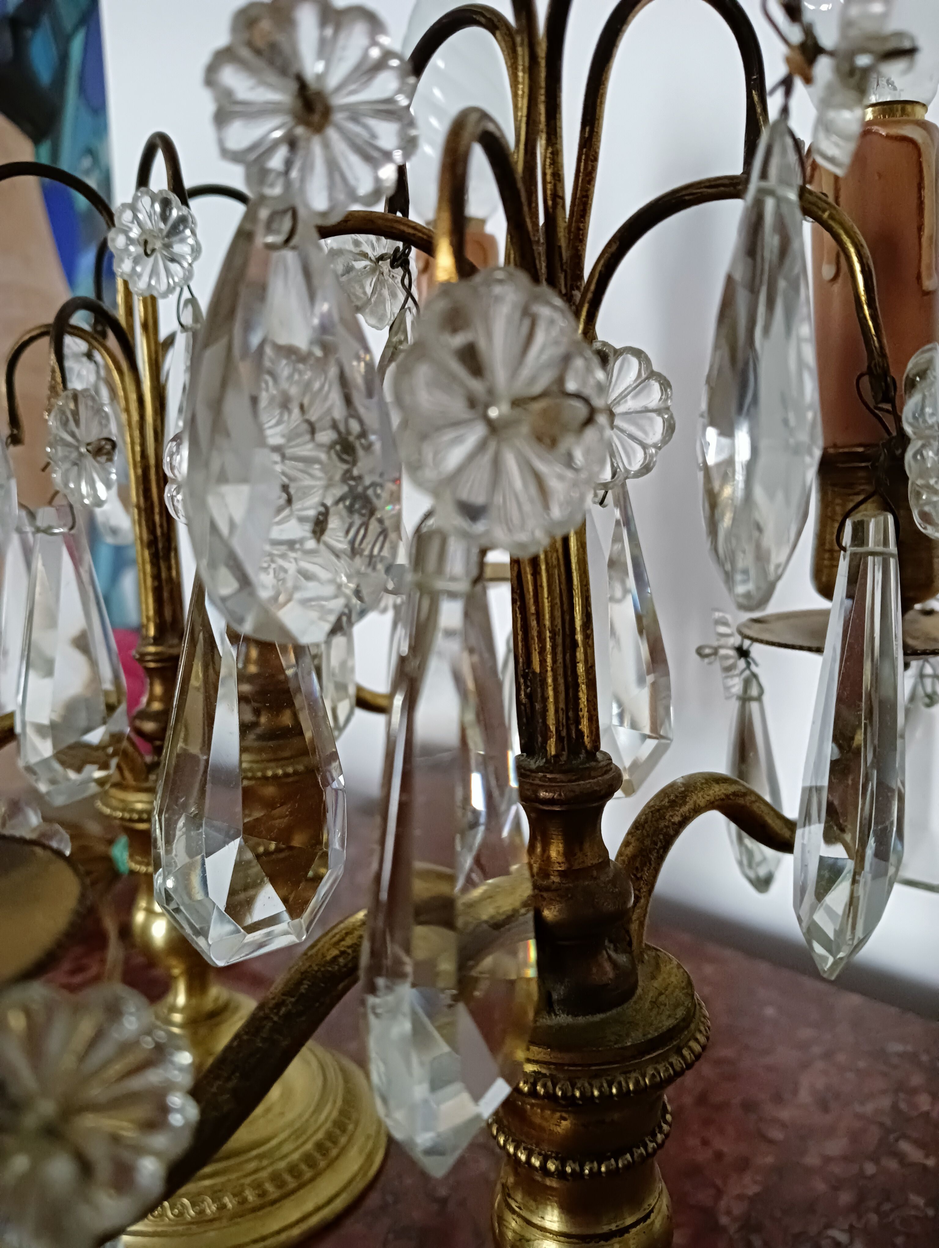 Pair of bronze girandoles with crystal pendants, two arms of lights.