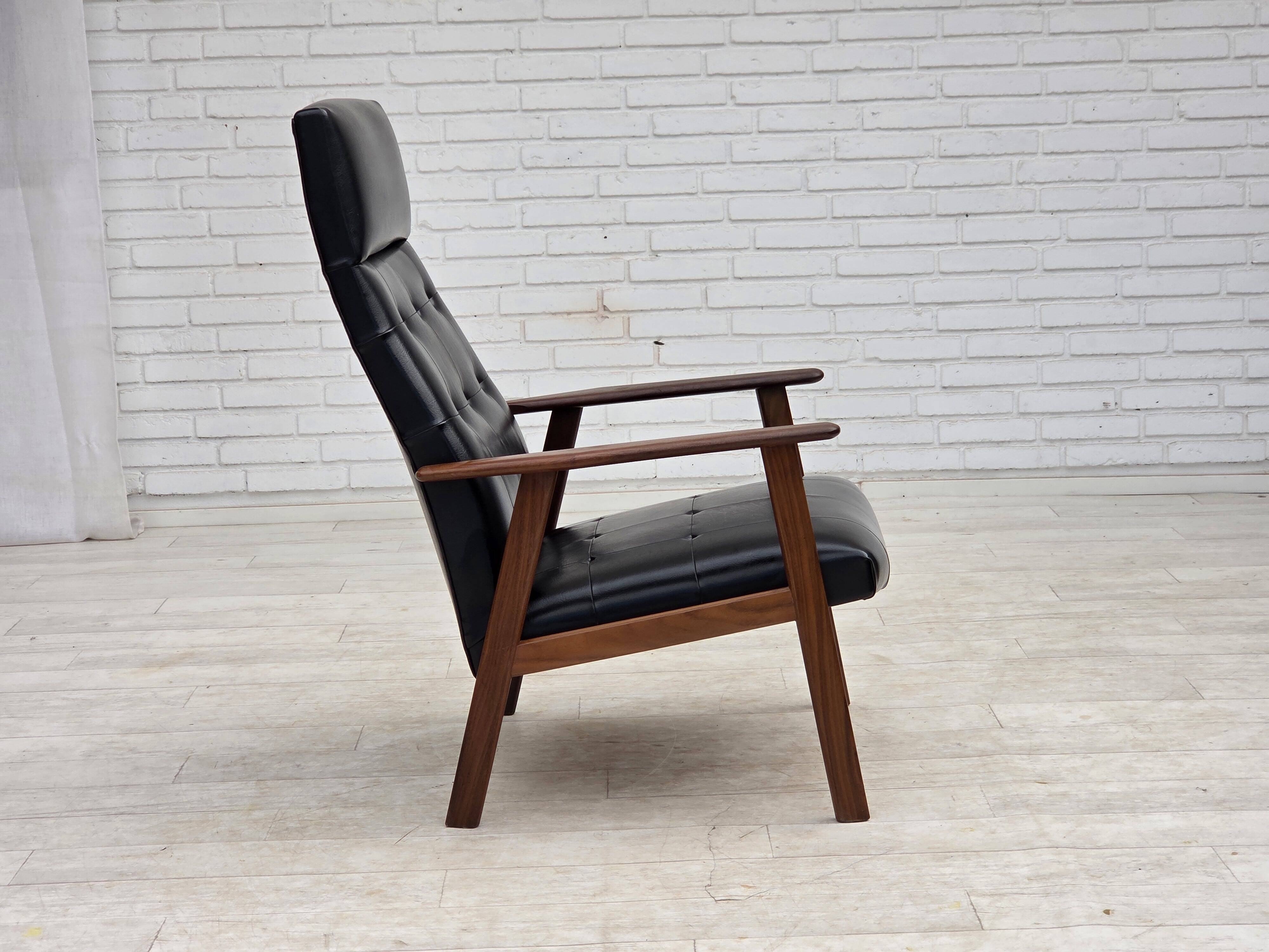 1970s, Danish armchair, black artificial leather, teak wood.