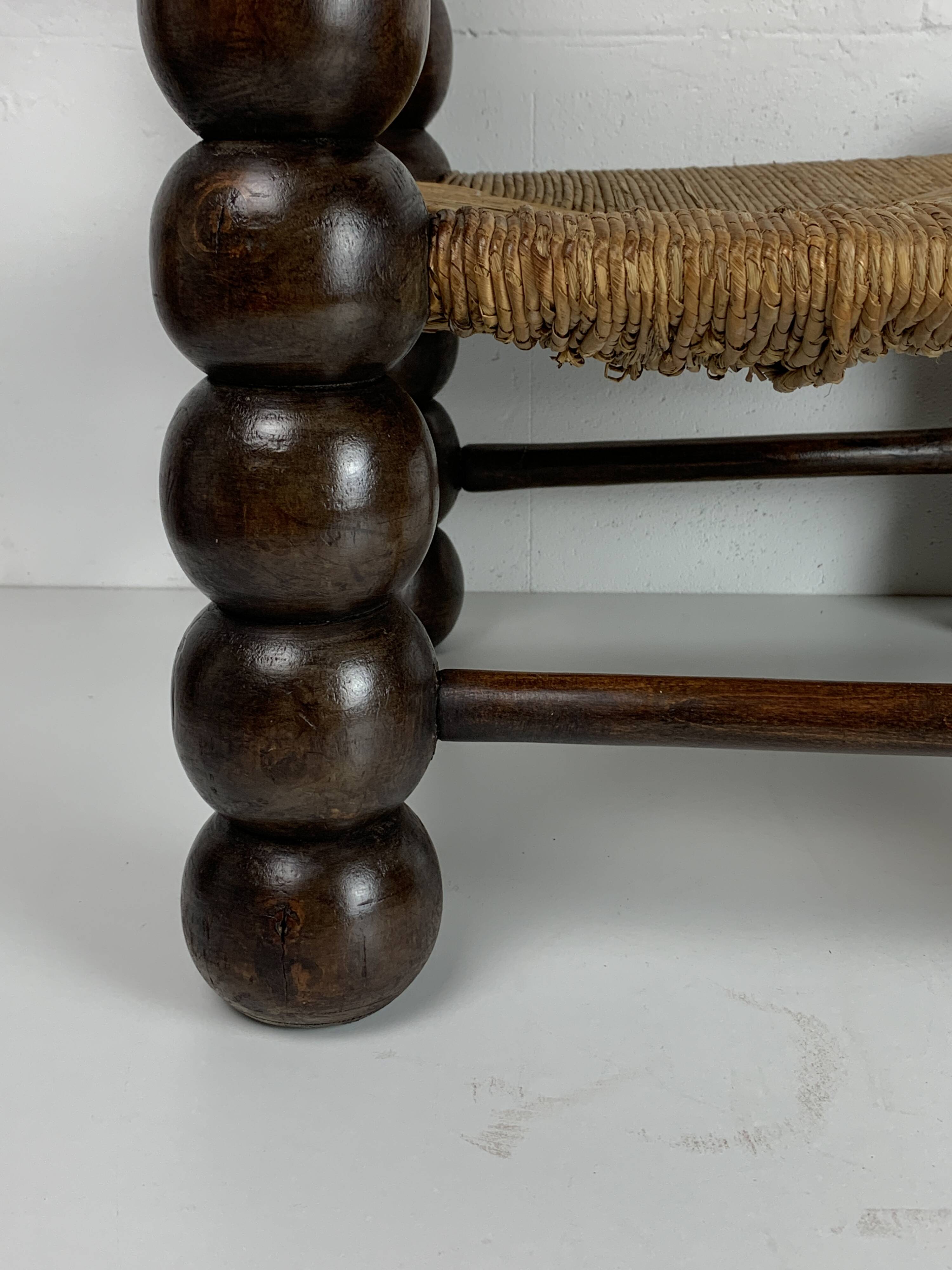 Chaise basse en bois tourné dans le style de Charles Dudouyt, France, années 1950