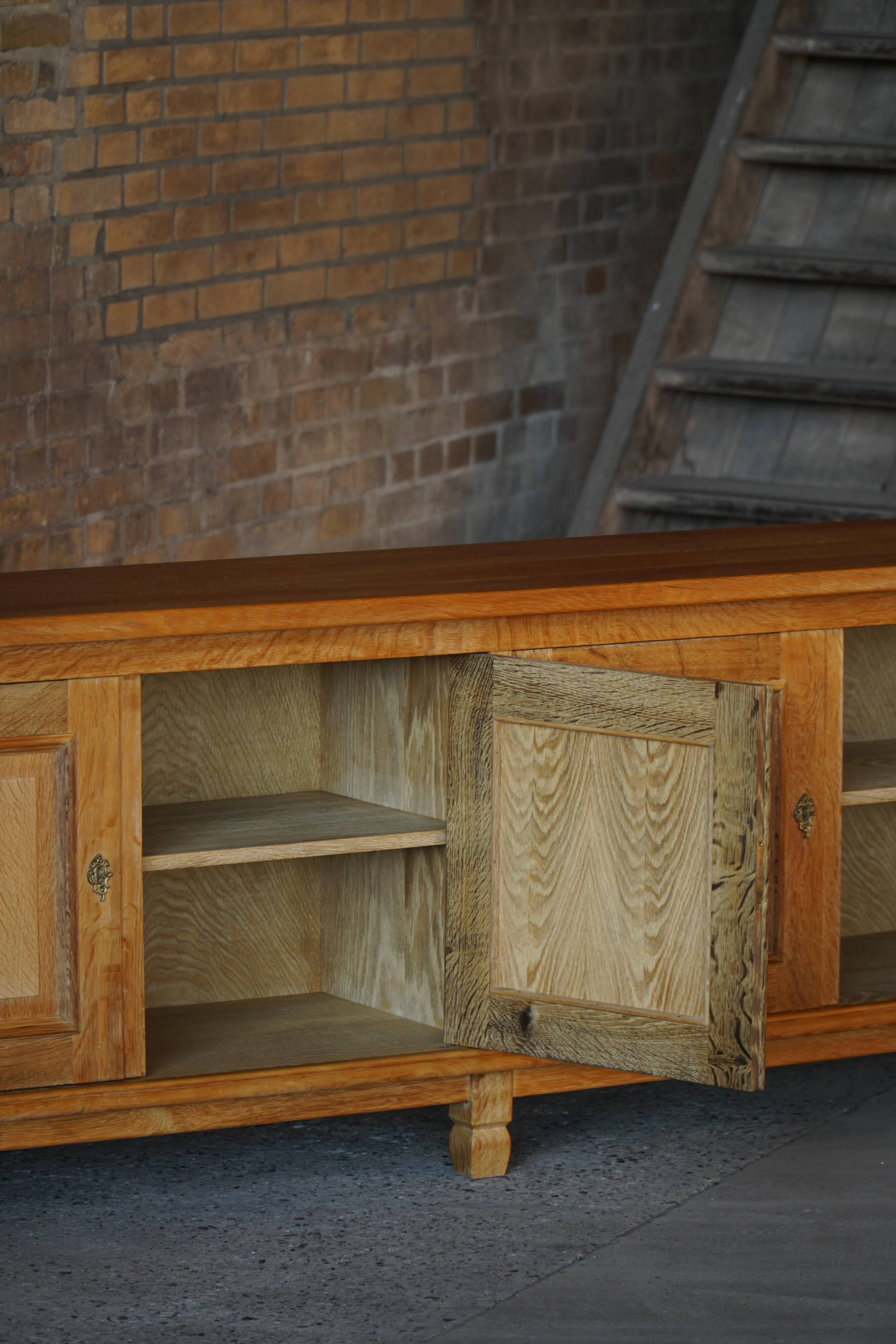 Modern Danish low enfilade in oak with panelled doors, mid-20th century.