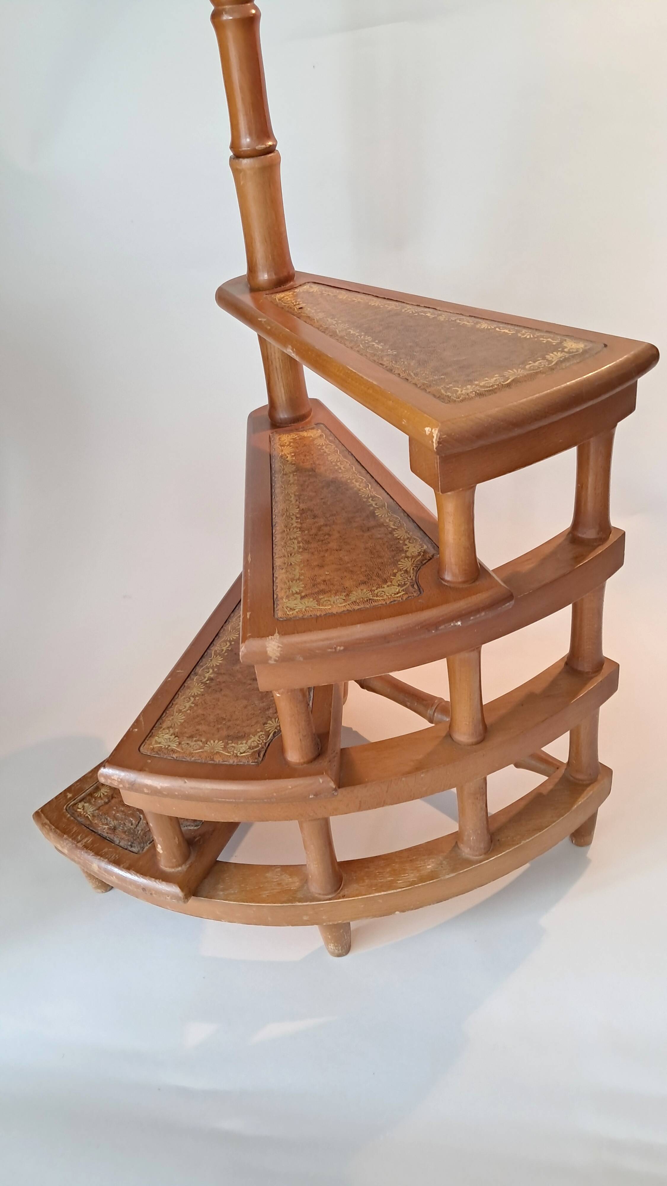 Library spiral staircase in beech and brown leather.
