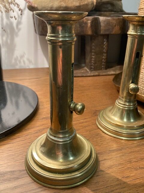 Pair of 19th-century brass pusher candlesticks