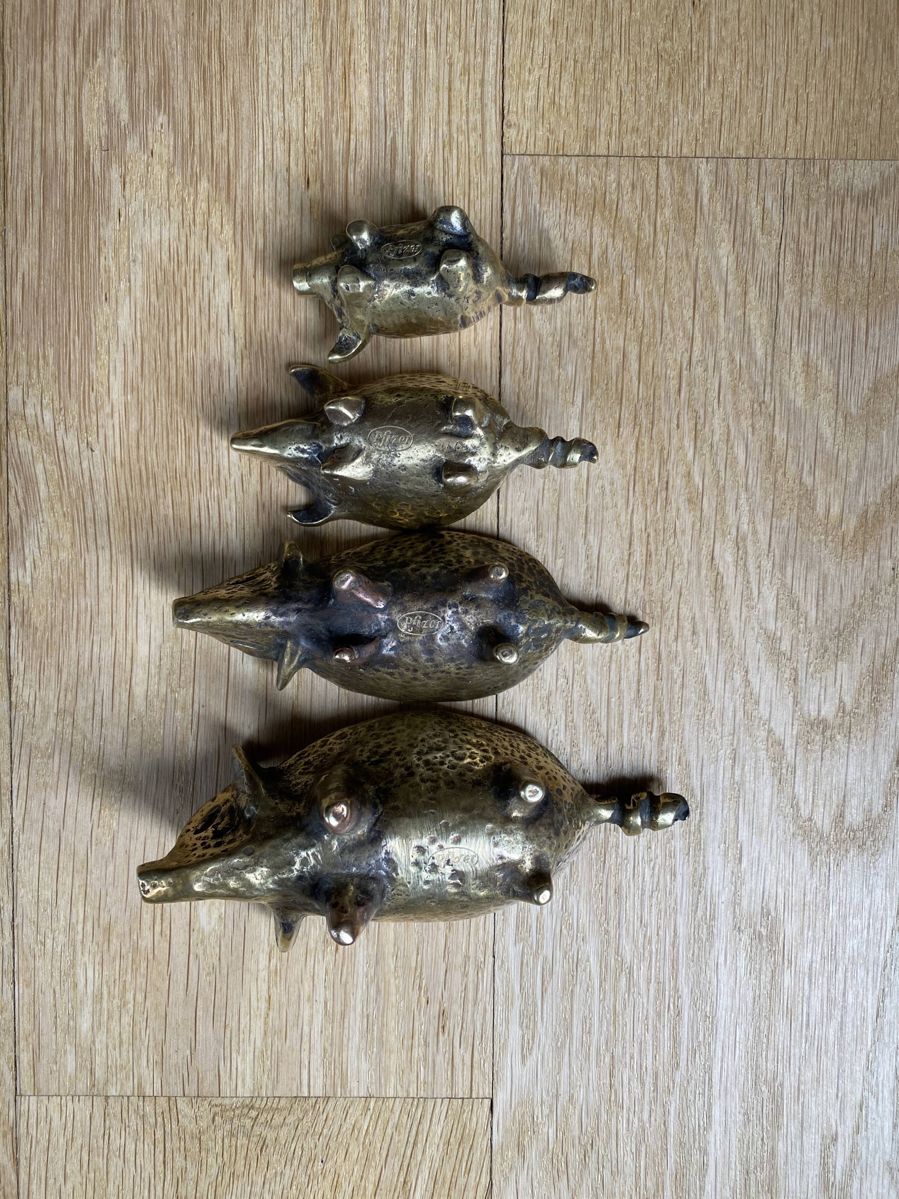 4 Pfizer bronze ashtray pigs