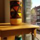 Mid-century pattern Vetrata vases and bowls by Aldo Londi for Bitossi Italy. Black, blue, orange and yellow on a brushed background.