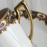 7 Limoges porcelain cups and saucers with gold decoration and floral motif.
