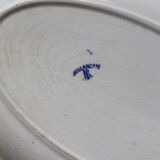 Antique serving dish in white and blue earthenware.