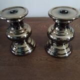 Two bronze-colored candlesticks
