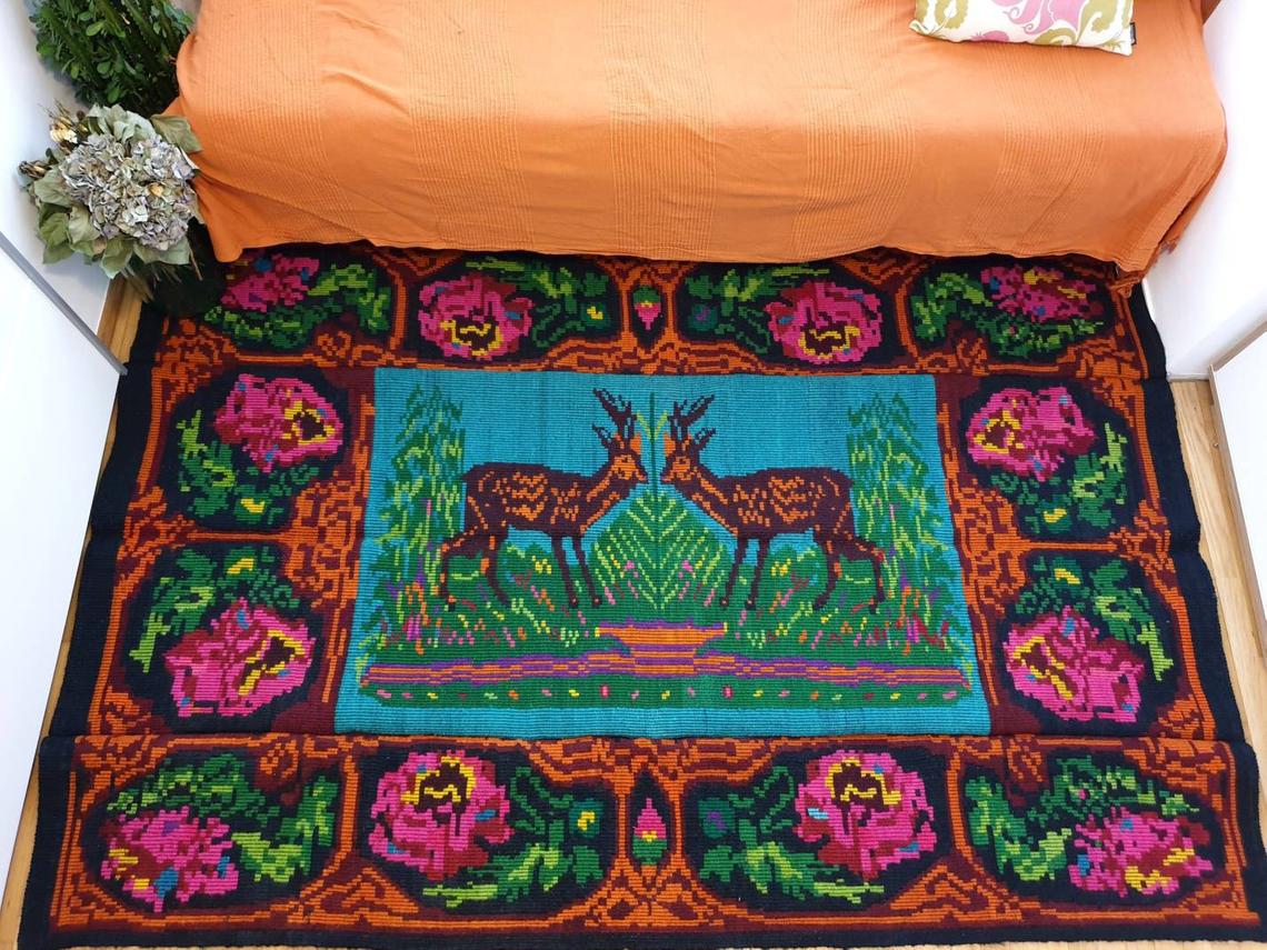 Vintage Romanian rug with deers, nature scenery on a floral background