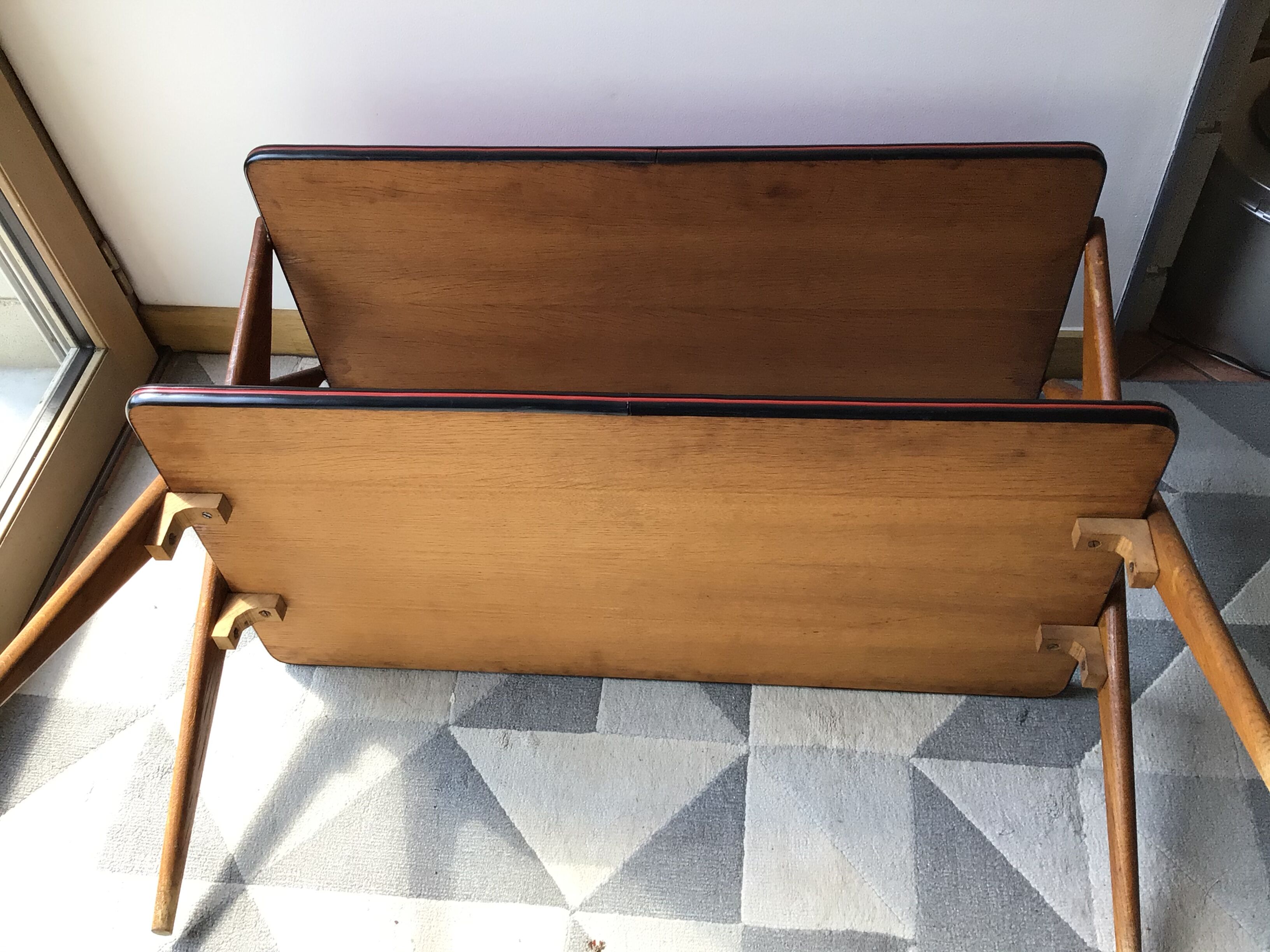 Double-footed red Formica wood spindles console