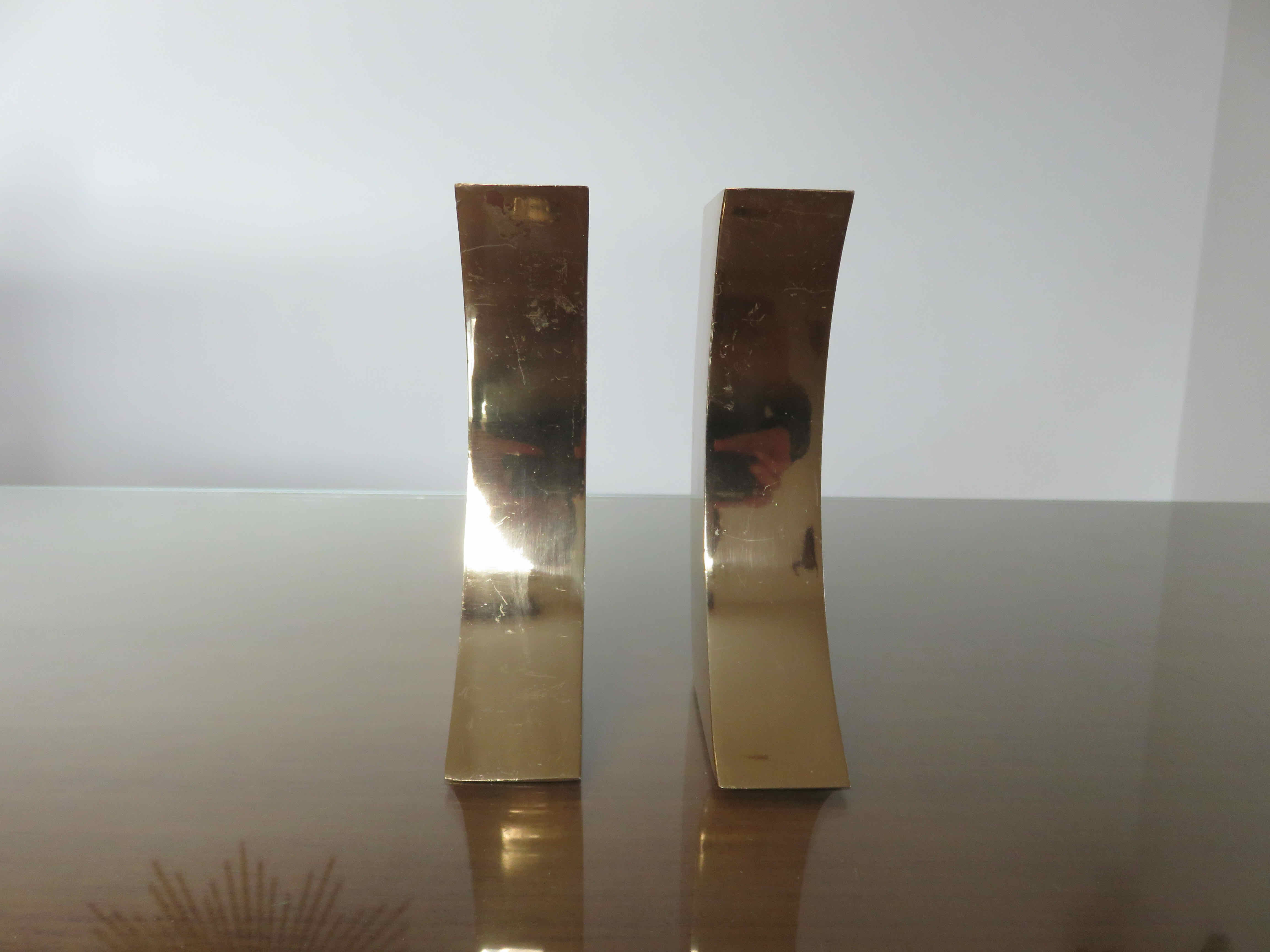 Pair of candle holders in golden brass, 70s