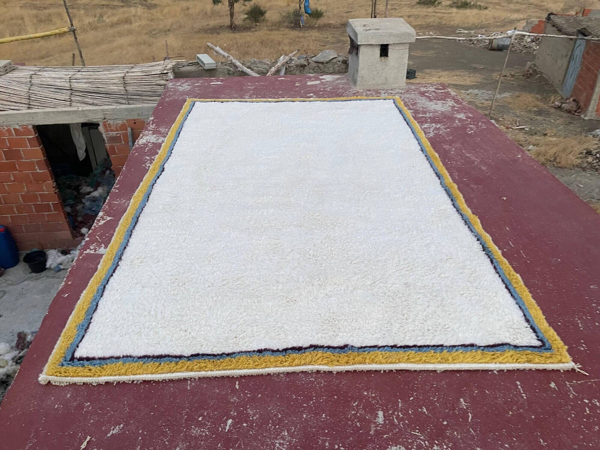 Large Moroccan Berber rug in cream 400x250 cm – yellow and blue border