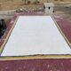 Large Moroccan Berber rug in cream 400x250 cm – yellow and blue border