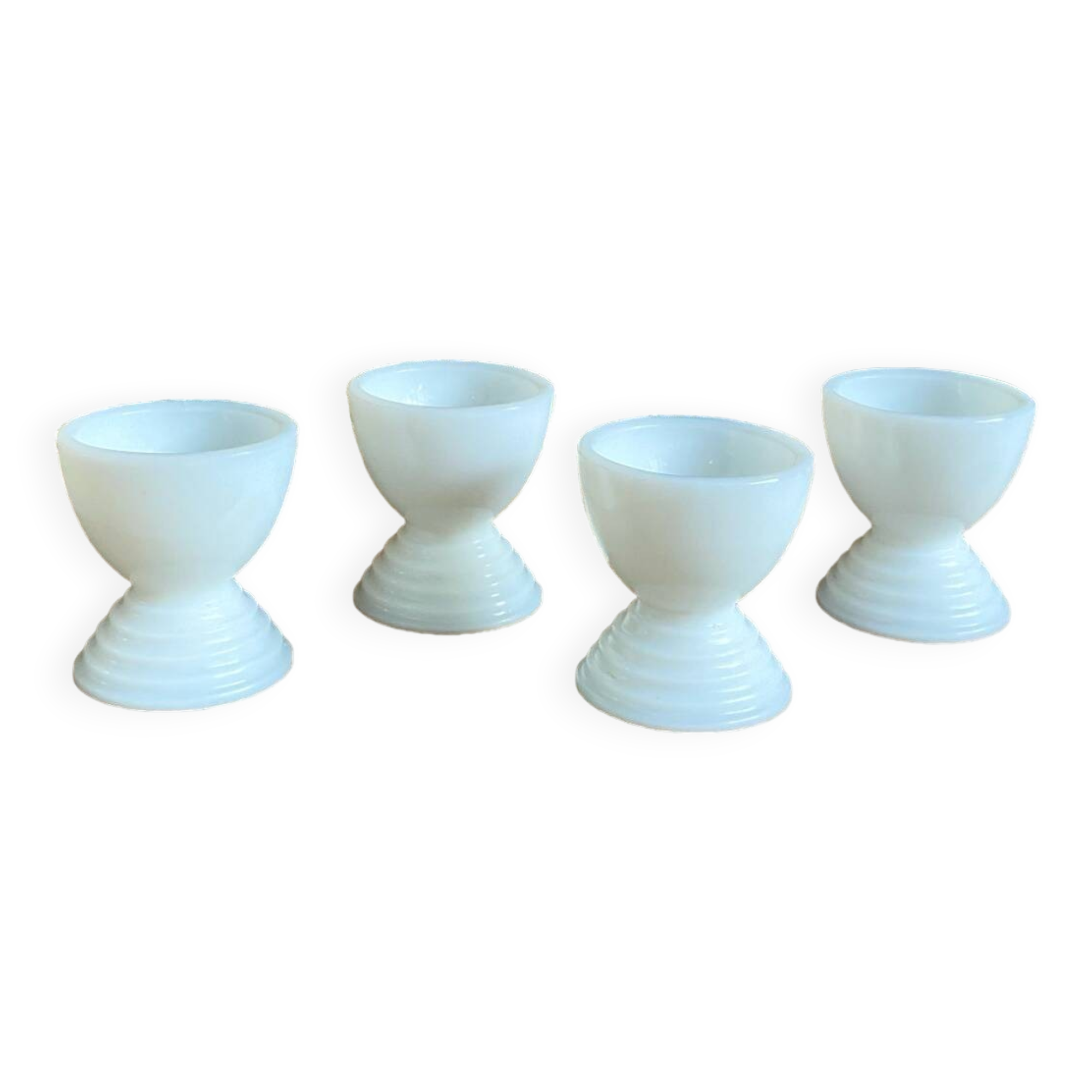 4 egg cups in white opaline glass