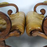 Pair of padded Chesterfield armchairs