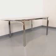 Vintage oval dining table in smoked glass and chrome metal, Space Age style.