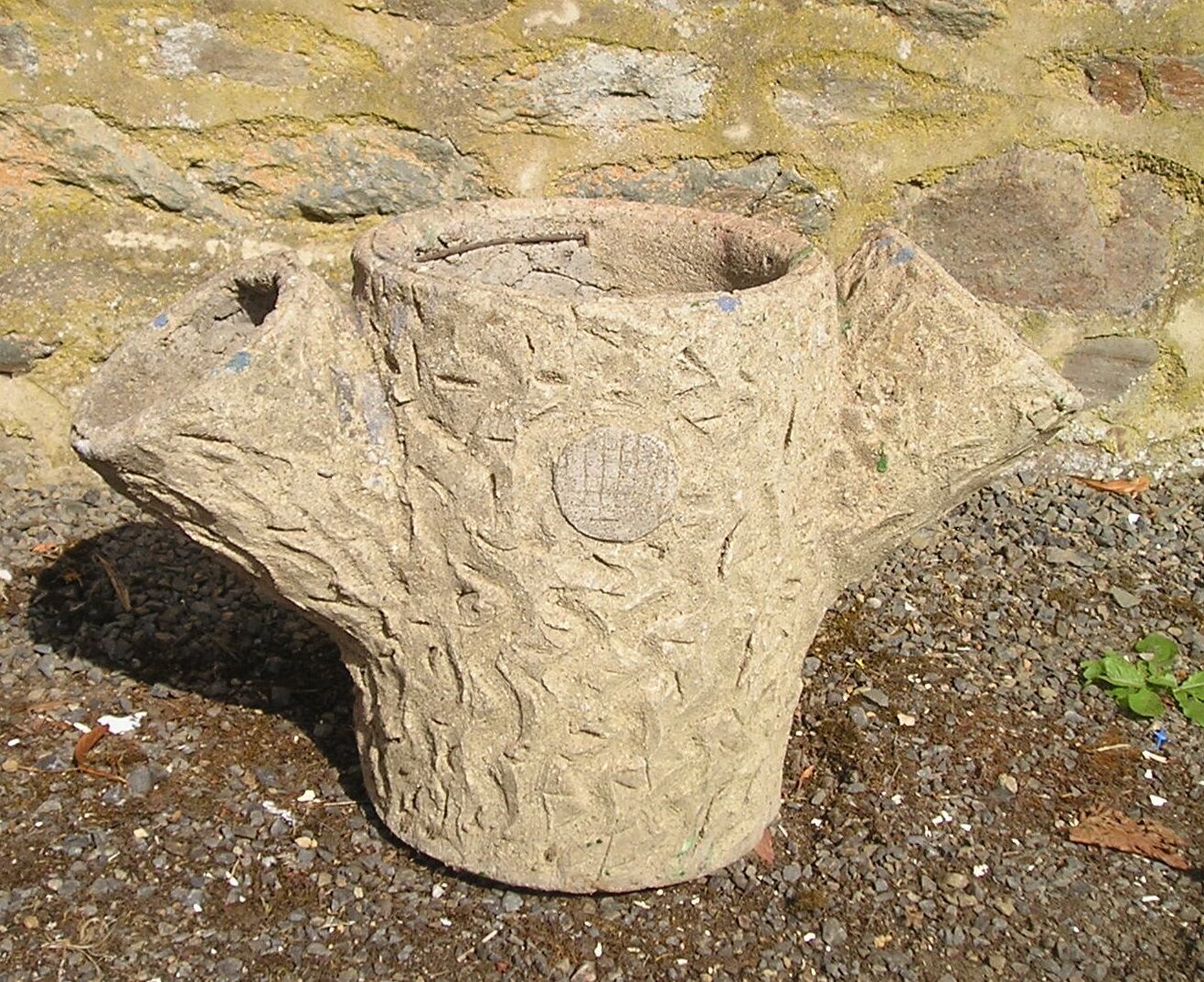 Tree trunk planter in concrete