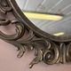 Miroir en bronze à volutes style rocaille