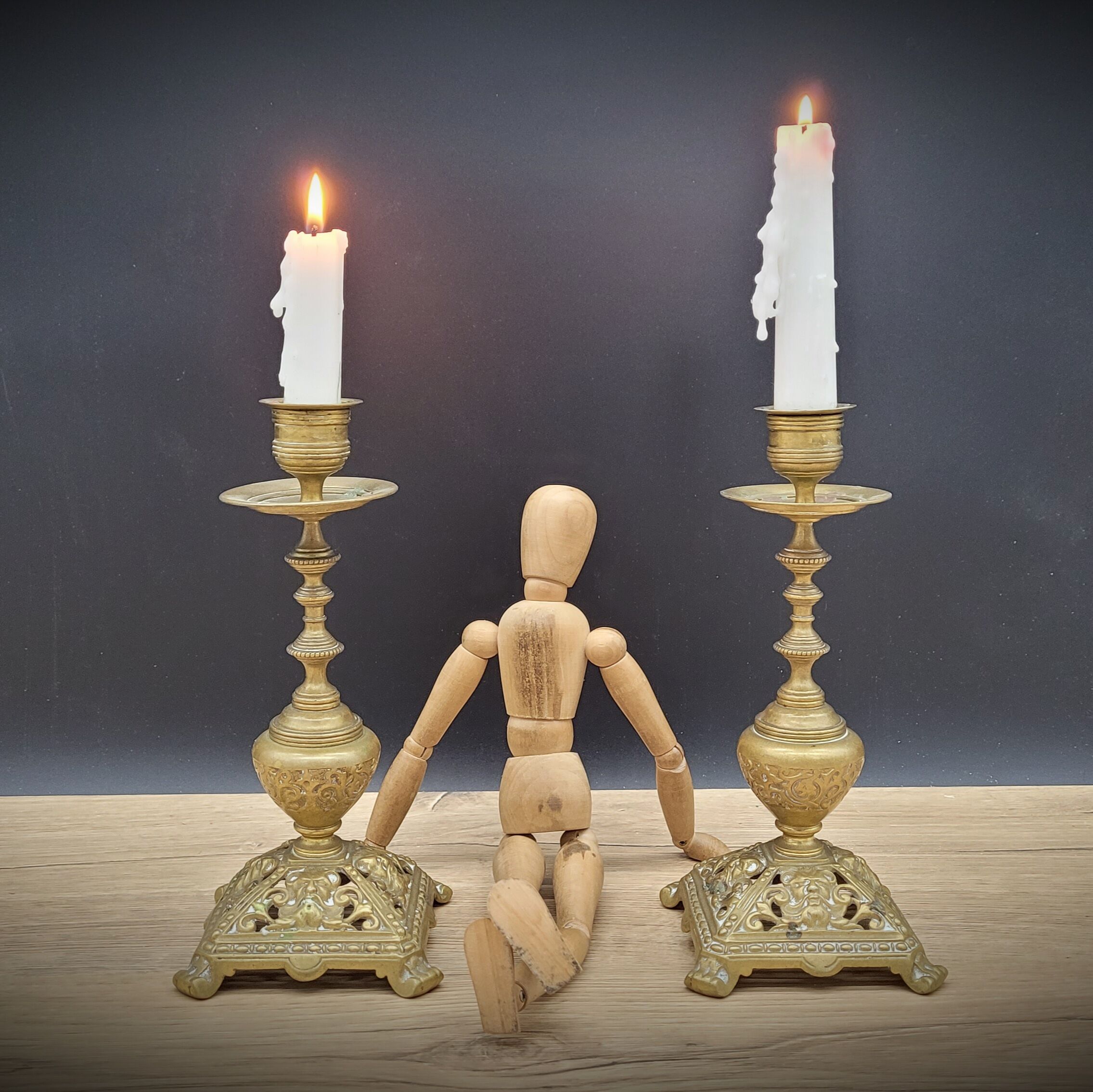 Duo worked brass candle holders
