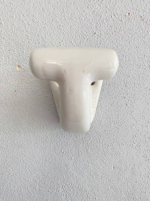 Enamelled earthen coat hook, 1900