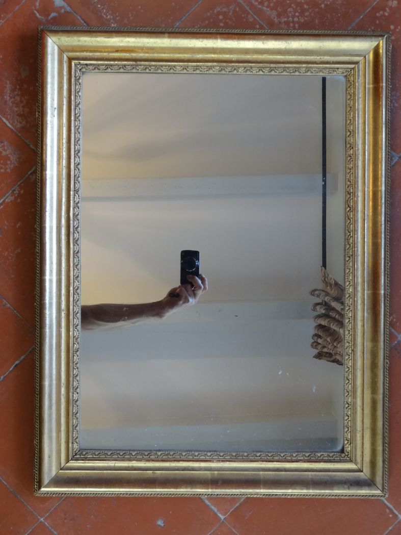 Empire period mirror, early nineteenth in gilded stucco wood H 72 cm