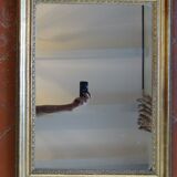 Empire period mirror, early nineteenth in gilded stucco wood H 72 cm