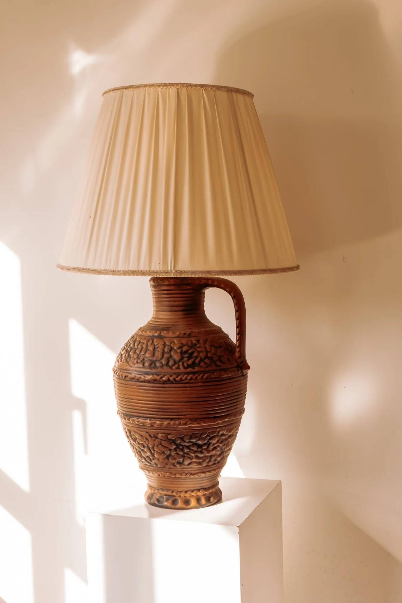 Large ceramic table lamp from West Germany with a pleated shade.