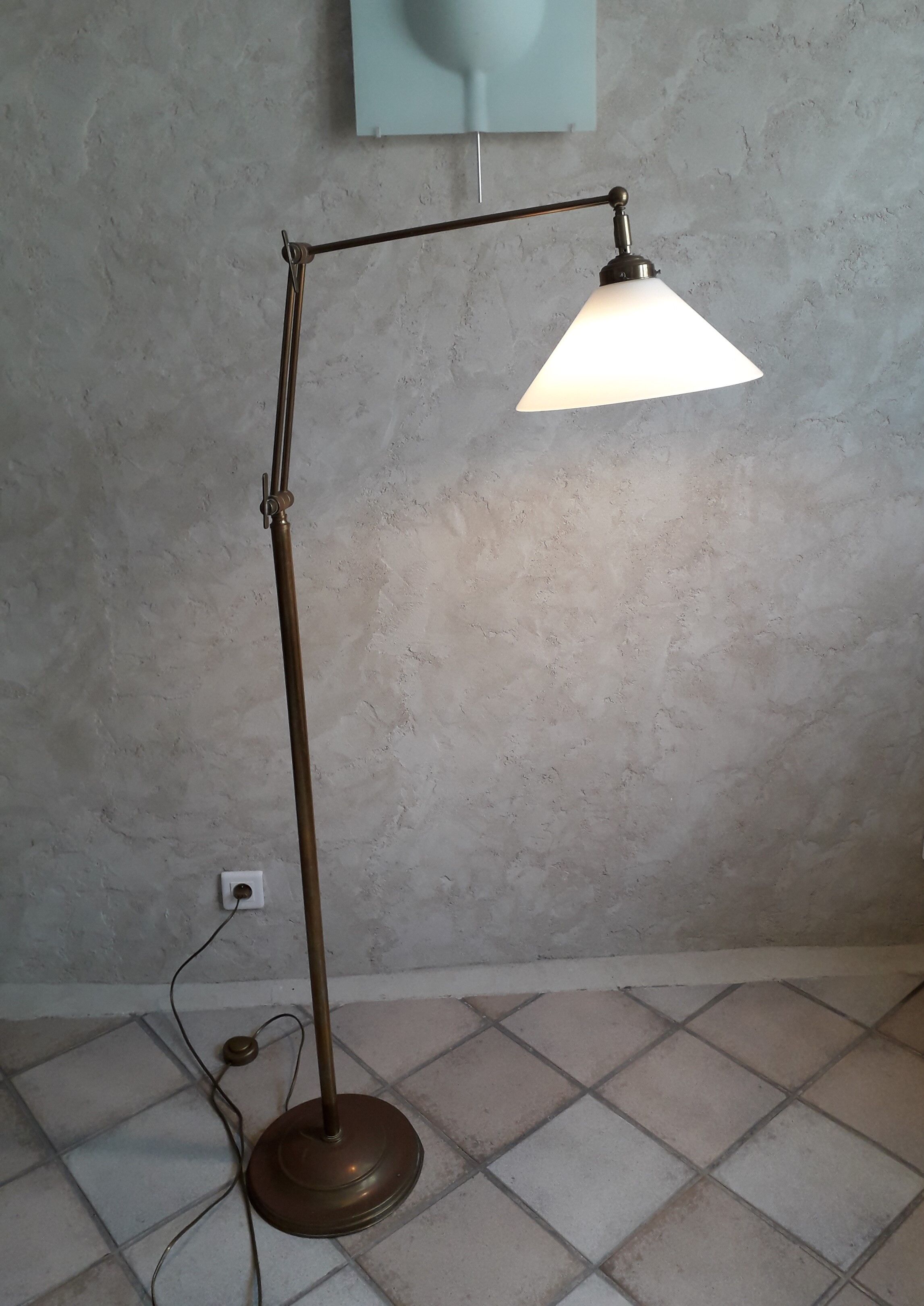 Articulated brass floor lamp