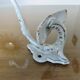 Pair of enameled cast iron coat hooks, 19th