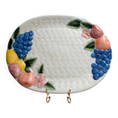 Vintage oval serving dish in majolica – Relief fruit decoration and woven basket design.