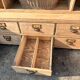 Large antique workshop furniture with drawers and shelves.