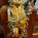 Empire style half-moon shaped mahogany bookcase with putti
