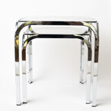 Pair of chrome nesting tables with smoked glass tops