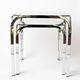 Pair of chrome nesting tables with smoked glass tops