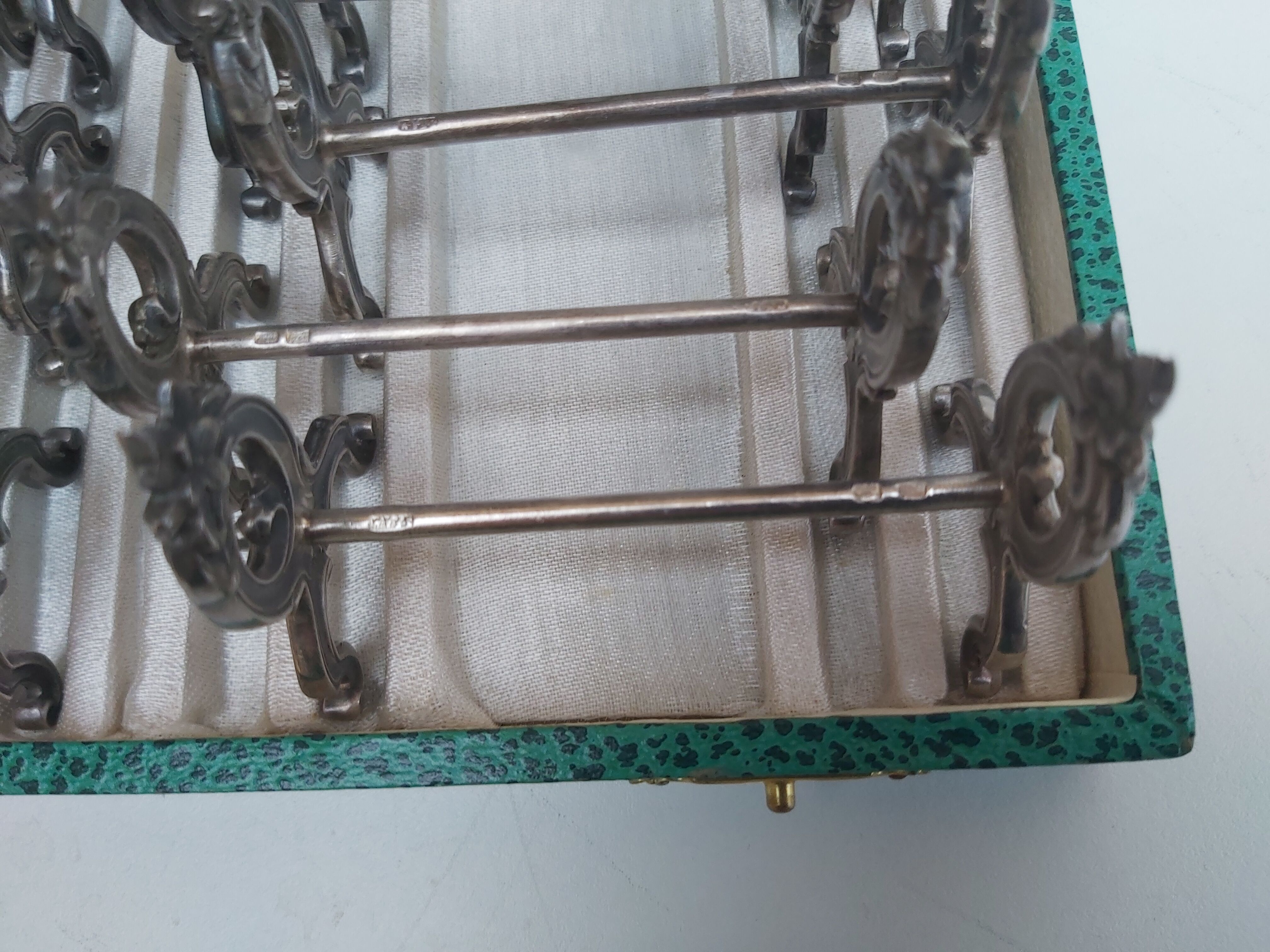 12 knife holders in their SFAM silver metal box
