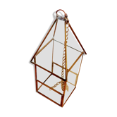 Greenhouse in the shape of a small house
