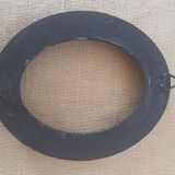Black oval frame