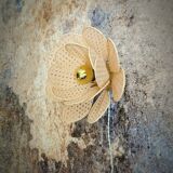 Flower wall light made of rattan petals and nude embroidery