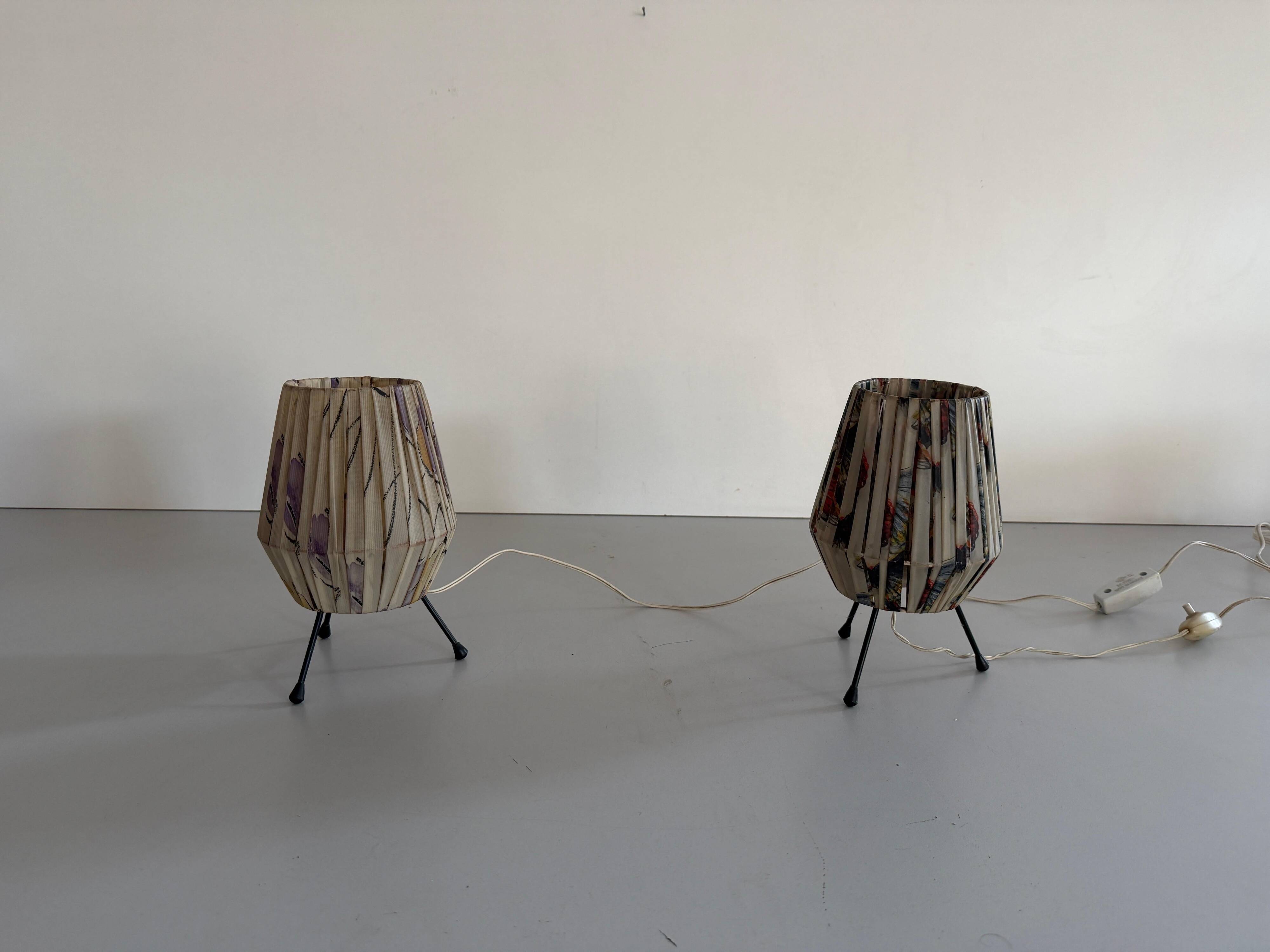 Pair of table lamps with plastic shades and tripod base, 1960s, Italy