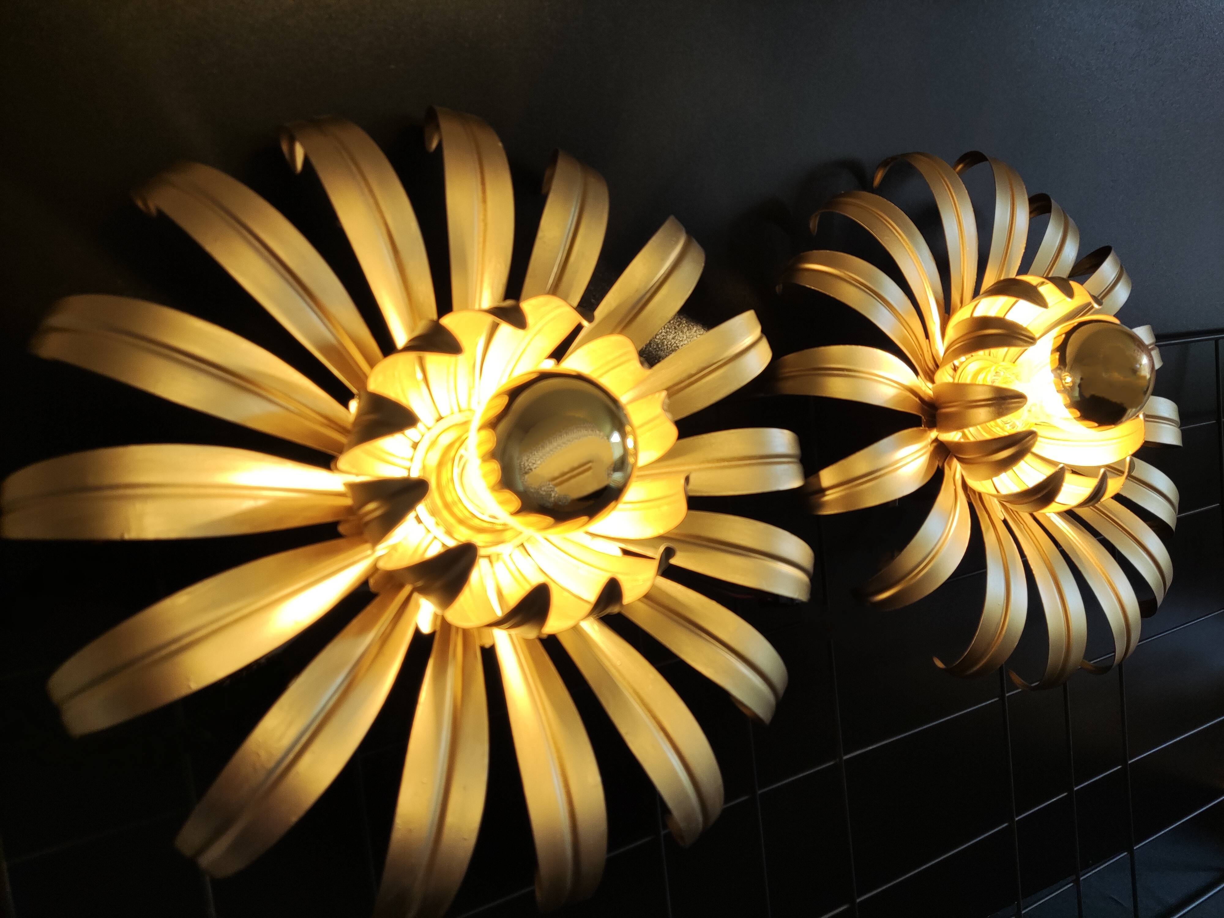 Golden metal flower sconces