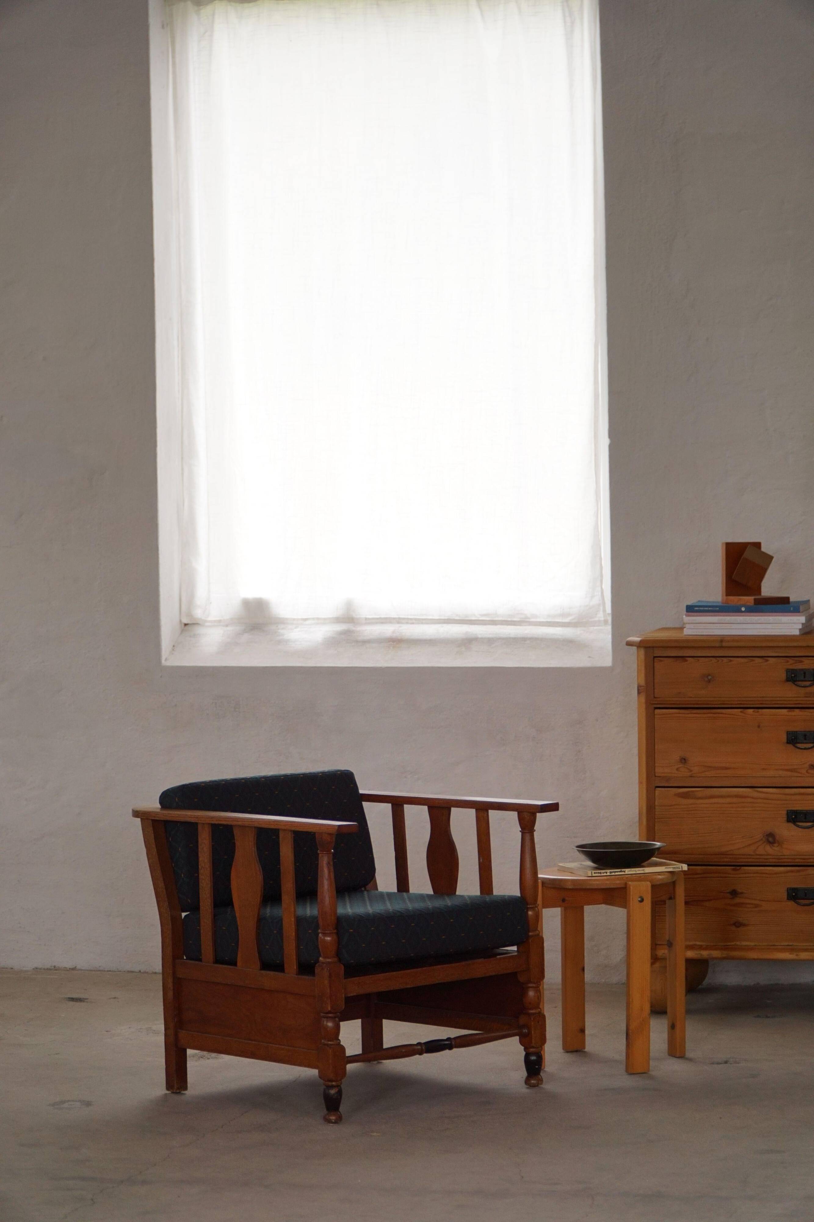 Art Nouveau, pair of oak lounge chairs, reupholstered in style fabric, 1920s.