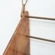 Wall-mounted walnut bookshelf by Carl Auböck, 1950s