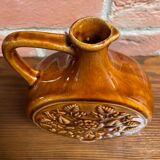 German round vase with floral motif, ornamental brown ceramic jug with handle