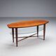 Assymetrical coffeetable with glass storage and cross leg details