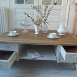 Coffee table on casters, made from an old desk, pearl gray base and belt.