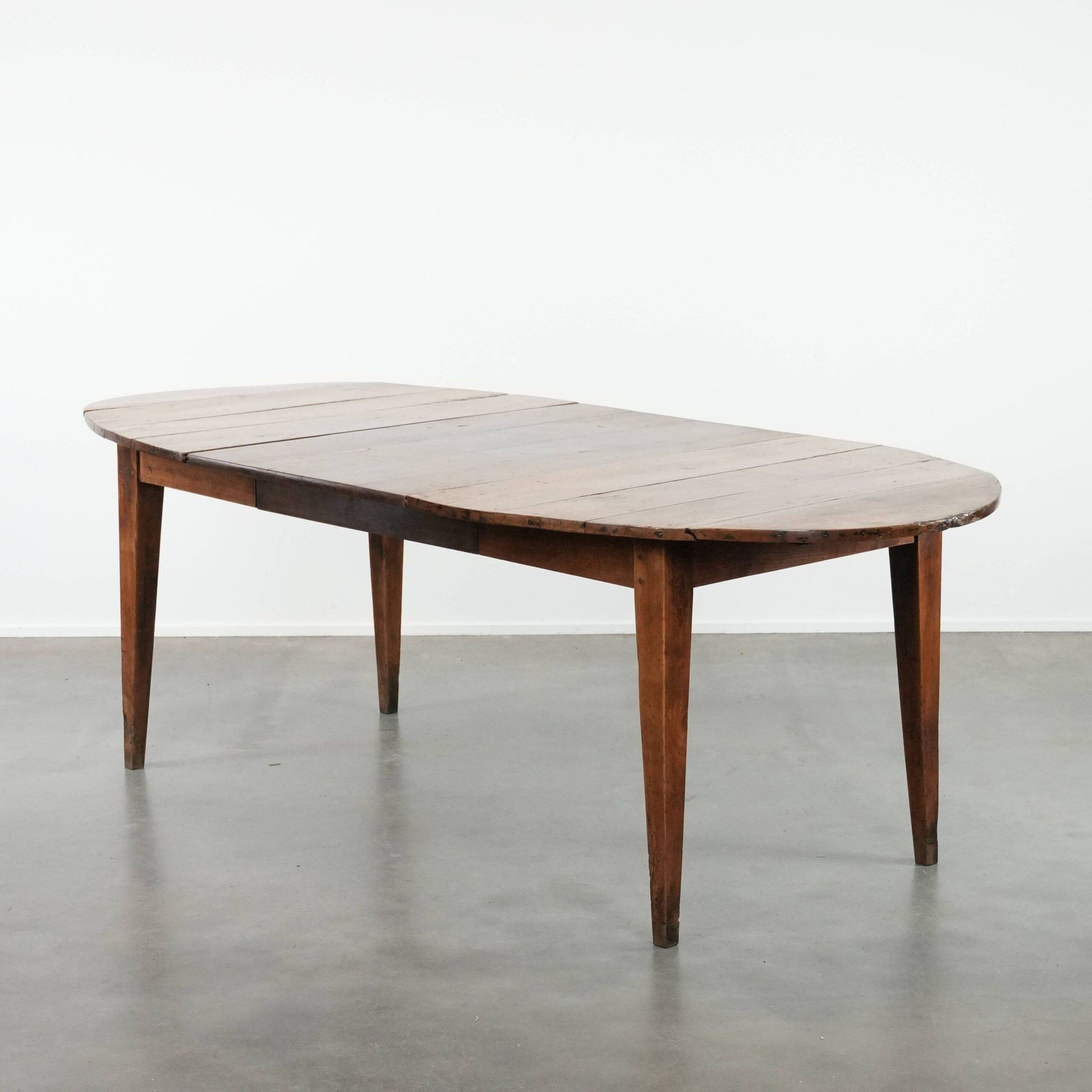 Rare antique oval French extendable dining table made of fruitwood